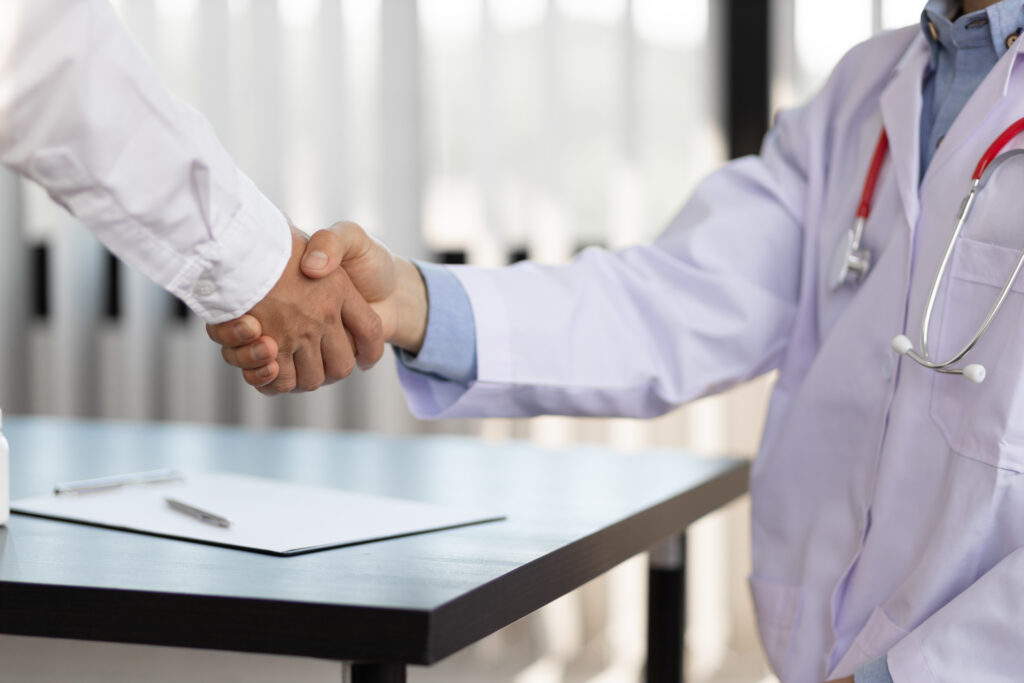Handshake. The concept of medical cooperation and health consulting.